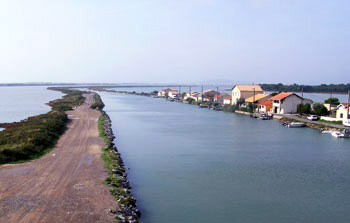 Bike trip through France with trailers alongside canals through lakes